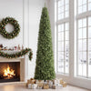 12 FT artificial Christmas tree with 1818 PVC branch tips, elegantly displayed beside a fireplace with holiday gifts underneath.