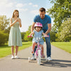 Child riding a pink 12-inch bike with training wheels, featuring adjustable handlebars and a hand brake for safety.