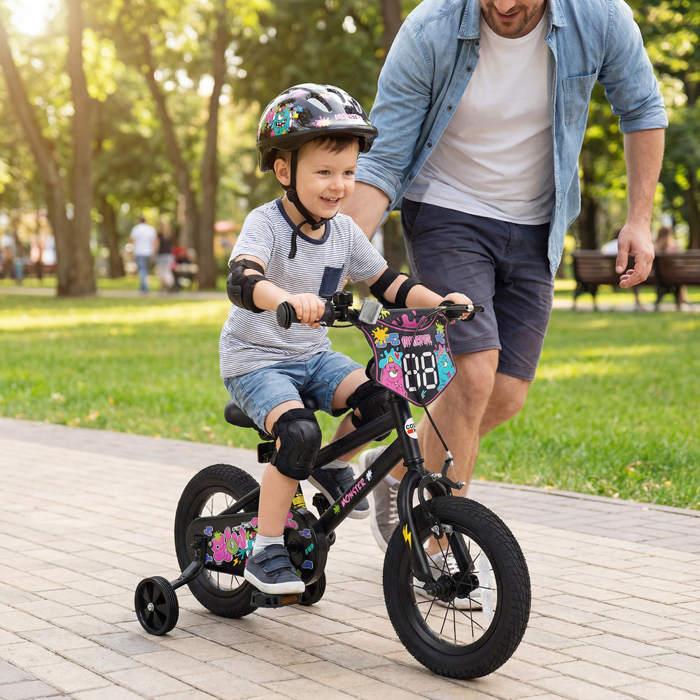 Kids bike with training wheels in black, featuring bright monster graphics, adjustable seat, and hand brake for safety.