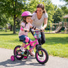 12-inch pink kids bike with training wheels, featuring bright graphics and adjustable seat, perfect for outdoor fun.
