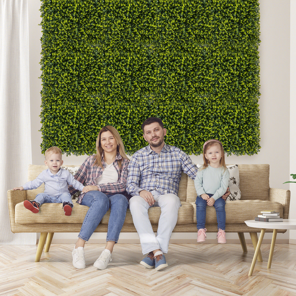 Faux Eucalyptus panels in a living room setting, perfect for creating privacy screens or green wall backdrops indoors.