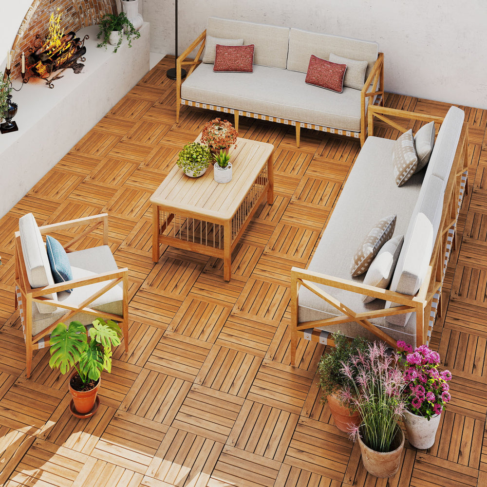 Acacia wood interlocking deck tiles arranged on a patio, showcasing natural beauty and waterproof design for outdoor.