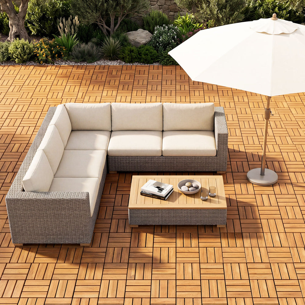 L-shaped outdoor sofa set with beige cushions and a coffee table, perfect for patio relaxation.