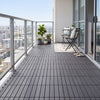 Gray 12” x 12” waterproof PP plastic interlocking deck tiles arranged on a balcony for stylish outdoor flooring.