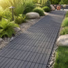 Gray 12” x 12” waterproof PP plastic interlocking deck tiles arranged on a garden pathway for easy outdoor installation.