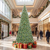 12 ft artificial Christmas tree with 4188 branch tips stands decorated in a grand shopping mall display.