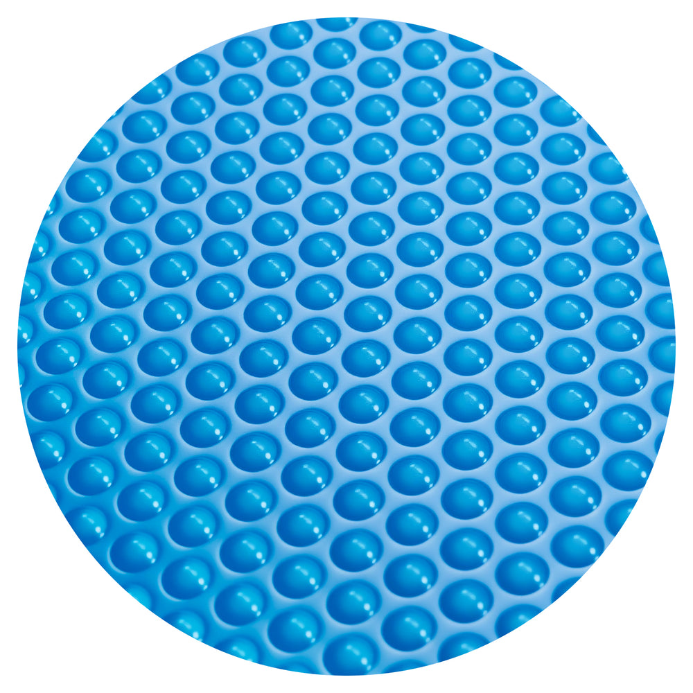 Close-up of the blue bubble design of a pool cover, made from durable PE material for effective heat retention and.