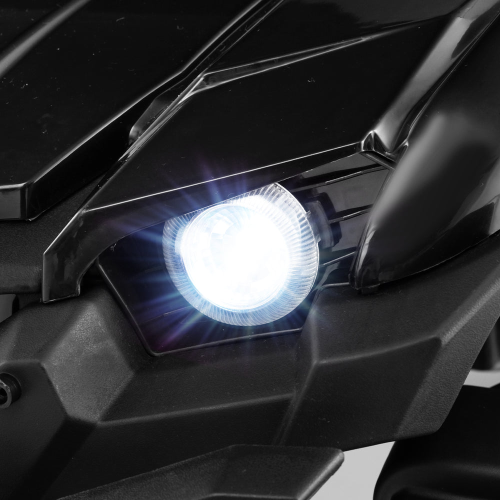 Bright LED headlight of the 12V battery-powered electric vehicle in black, enhancing safety and style for kids.