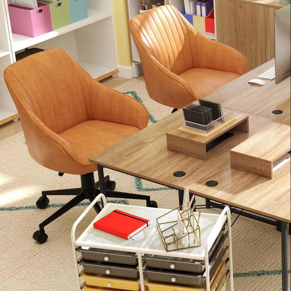 Two Ergo Comfort swivel chairs with lumbar cushions beside a spacious L-shaped desk in a modern office setting.