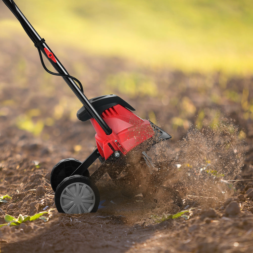 14-inch electric tiller with 10-amp motor cultivating soil, ideal for small to medium gardens, featuring ergonomic.