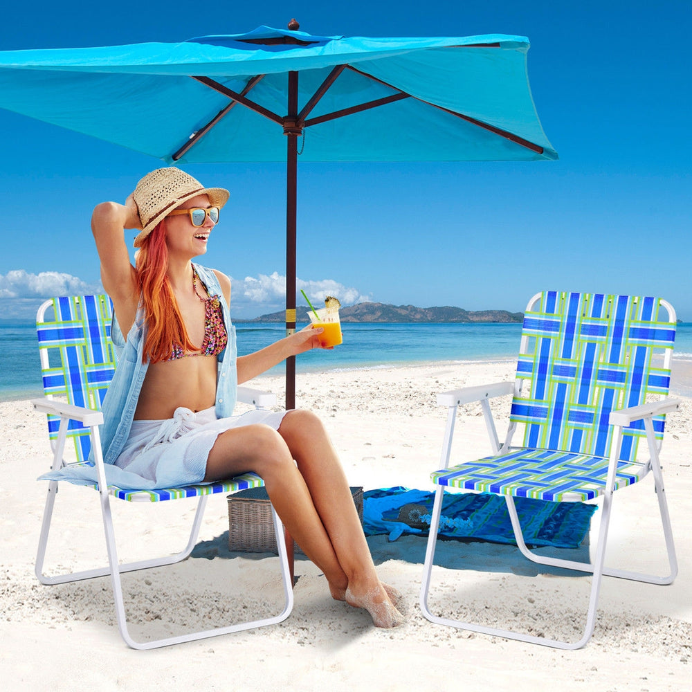 Folding beach chair set in blue webbing, featuring a sturdy frame, perfect for camping or lawn use.