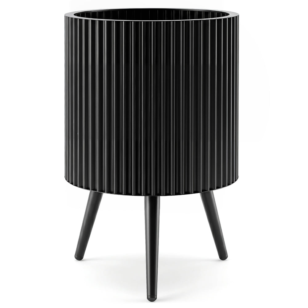 Fluted black metal plant pot with tapered legs, designed for indoor and outdoor use, enhancing plant growth and stability.