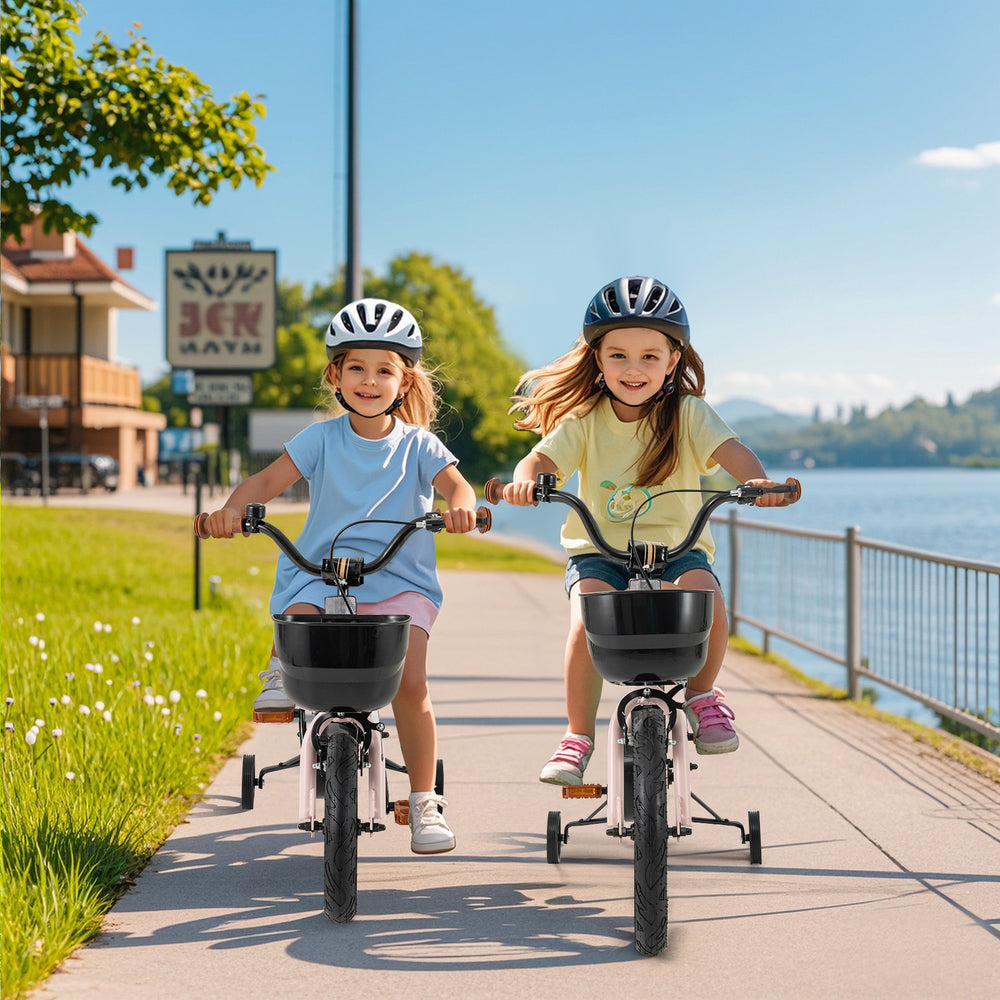 Two girls riding 14-inch kids bikes with baskets along a scenic path, featuring adjustable handlebars and training.