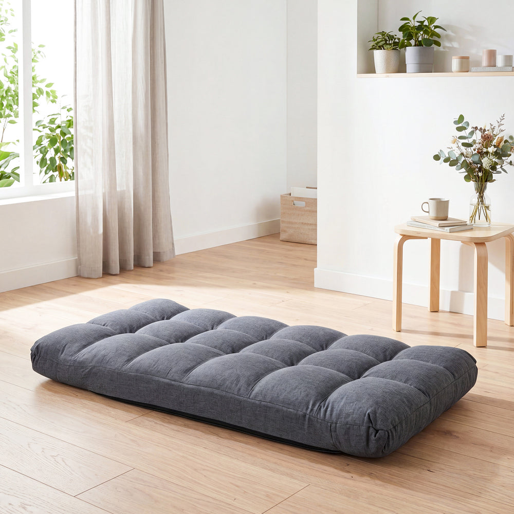 Adjustable gray floor chair with 14 positions, padded seat, and solid metal frame for ultimate comfort and support.