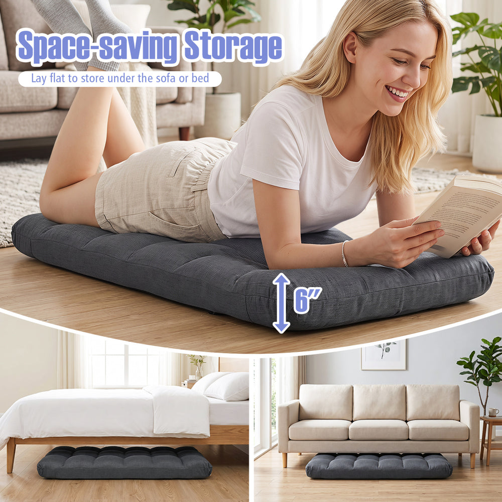 Adjustable gray floor chair with 14 positions and padded seat for comfort, easily stored under a sofa or bed.