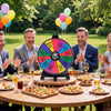 14-slot multicolor spin wheel with customizable sections, perfect for party games and events, shown in outdoor setting.