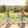 Two children riding a 14-inch kids bike with adjustable handlebars, featuring a removable basket for toys and snacks.