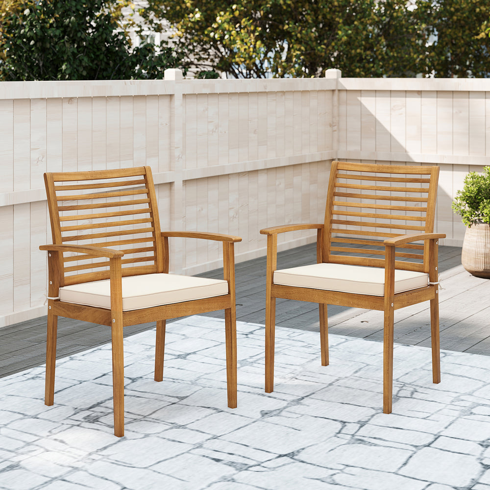 Set of 2 outdoor patio dining chairs in acacia wood with beige removable cushions, featuring a slatted backrest.