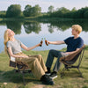 Portable camping chair in coffee color, featuring a breathable mesh seat and compact carrying bag, perfect for outdoor.
