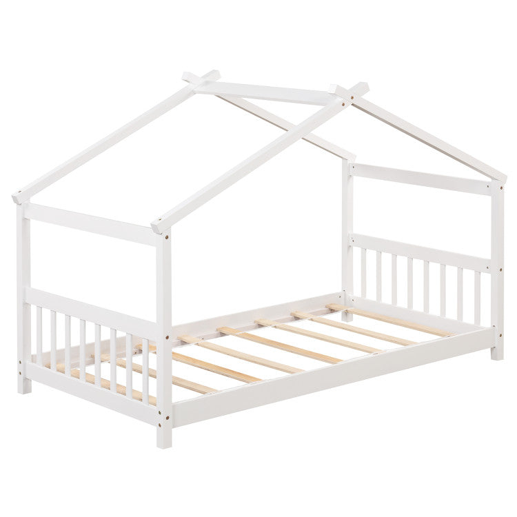 Twin size wooden house bed with slatted base, designed for safety and imaginative play in kids' room.