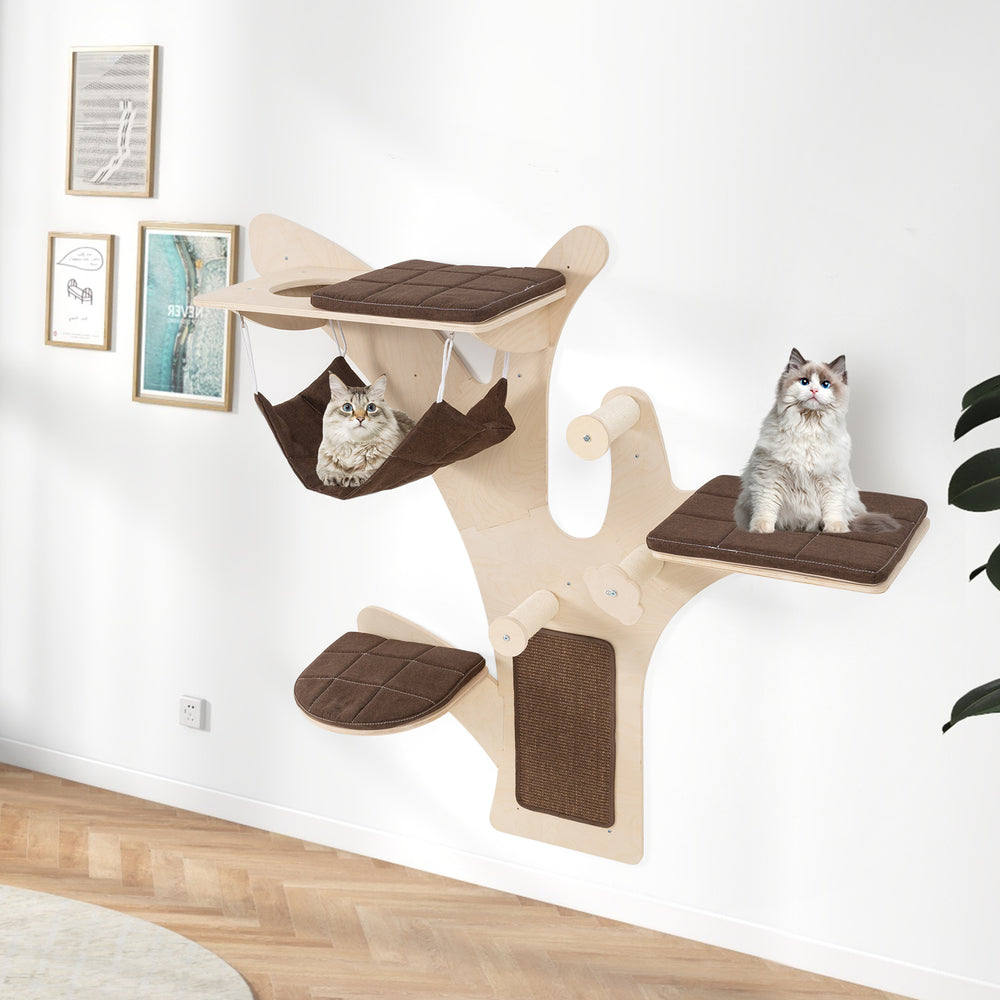 Wall-mounted cat tower with brown padded platforms and hammock, designed for play and relaxation in small spaces.
