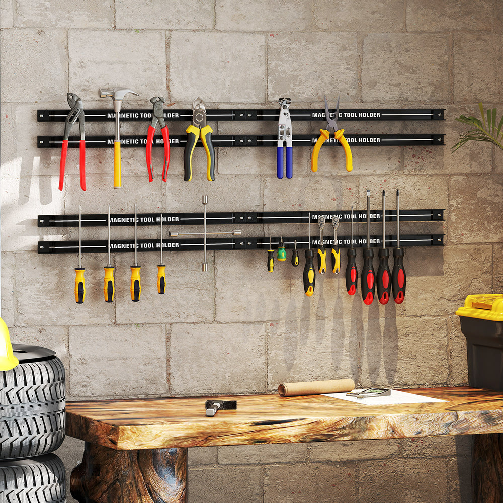 18-inch black magnetic tool holder strip with various tools mounted, ideal for organizing workspace efficiently.