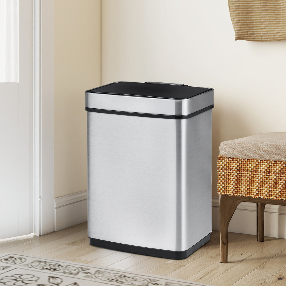 Stainless steel 16-gallon trash can with infrared sensor, dual compartments for waste sorting, ideal for kitchens and.