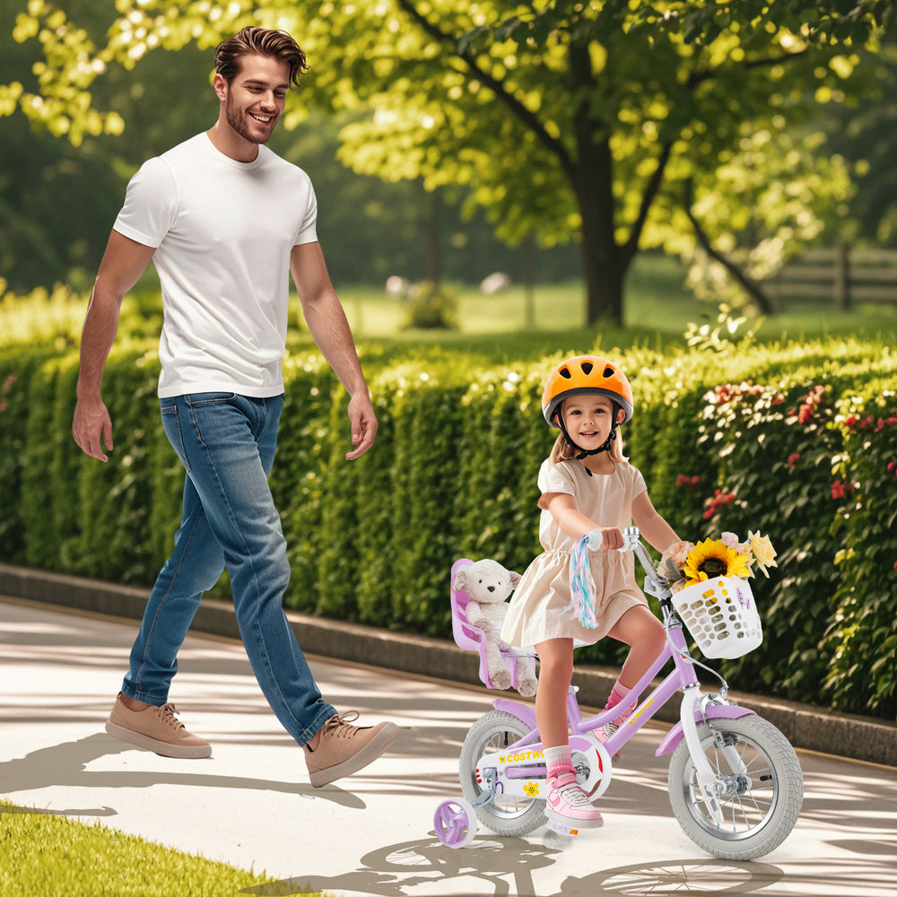 12-inch girls bike with doll seat and streamers, perfect for children aged 3-4, shown in a park setting.