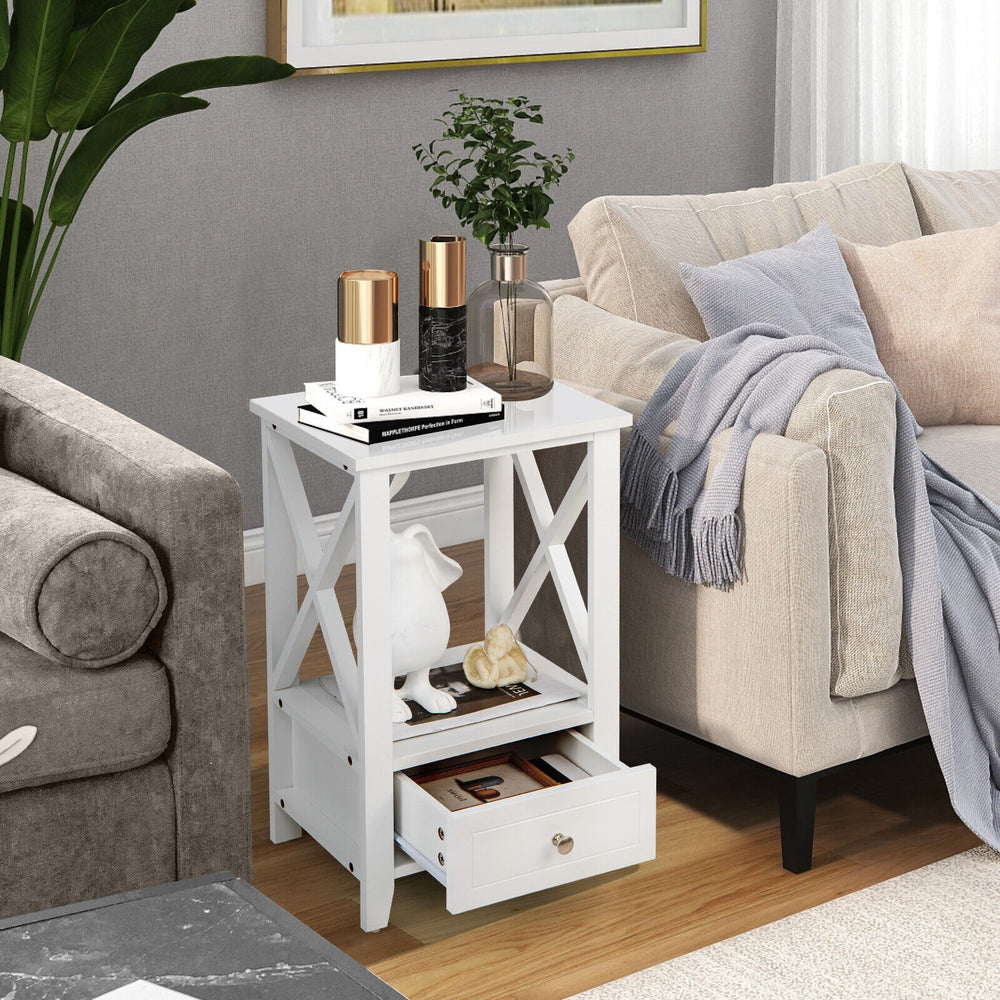 White 2-tier nightstand with storage drawer, open shelf, and X-shaped design, perfect for living room or bedroom use.