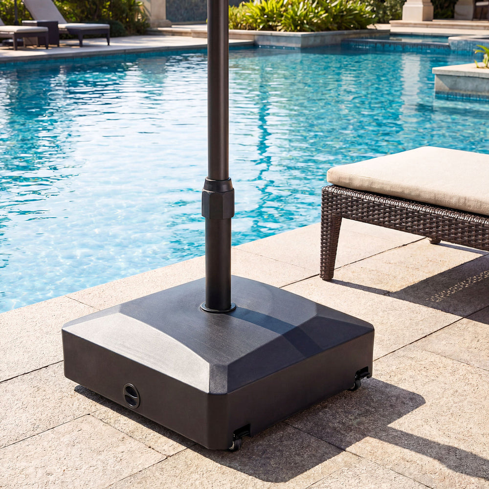 Fillable black umbrella base with wheels and locks, designed for stability and support for 6-10 ft market umbrellas.