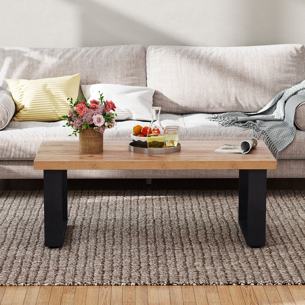Rustic 47" coffee table with thickened oak tabletop and black legs, perfect for living room decor and snacks.