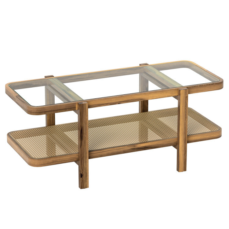 Coffee table with tempered glass top and PE rattan shelf, featuring solid acacia wood legs for modern living room decor.