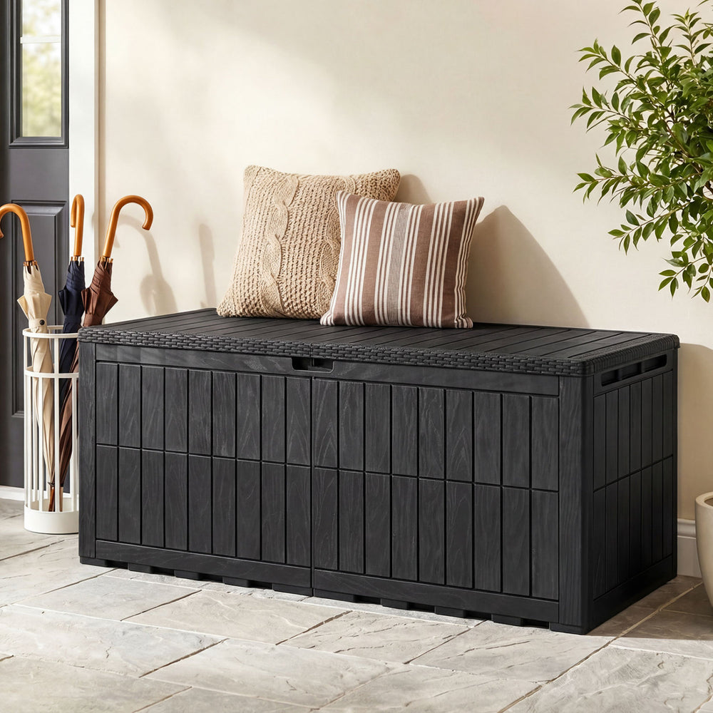 Black 180 Gal outdoor deck box with lid and handles, serving as a bench for pool supplies and garden tools.