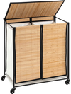 Two-section laundry hamper with lid, bamboo slats, and lockable wheels for easy sorting and mobility.