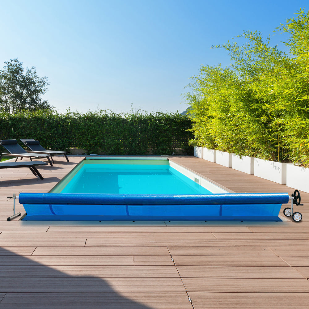 Aluminum pool cover reel set with blue cover, suitable for 4 to 18 feet in-ground pools, shown on a wooden deck.