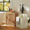 Natural bamboo tilt-out laundry hamper with removable fabric bin, perfect for bathroom or laundry room organization.