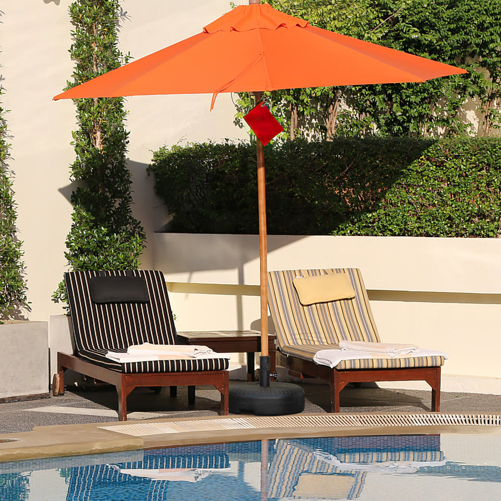 Heavy-duty round umbrella base stand with a large reservoir for stability, suitable for patio and garden use.