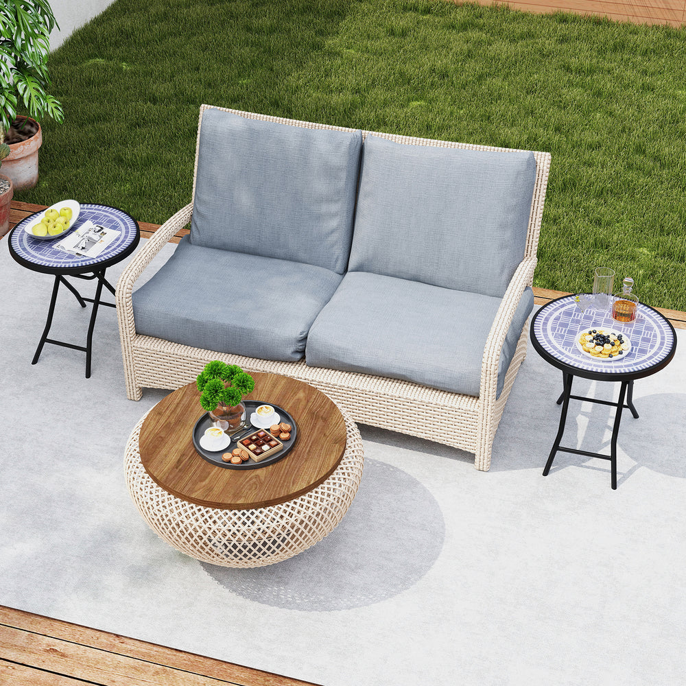 Round gray folding side table with tempered glass top, ideal for indoor and outdoor use, shown in a patio setting.