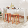 Two 18-inch outdoor wood bar stools with round seats and footrests, perfect for patio or poolside use.