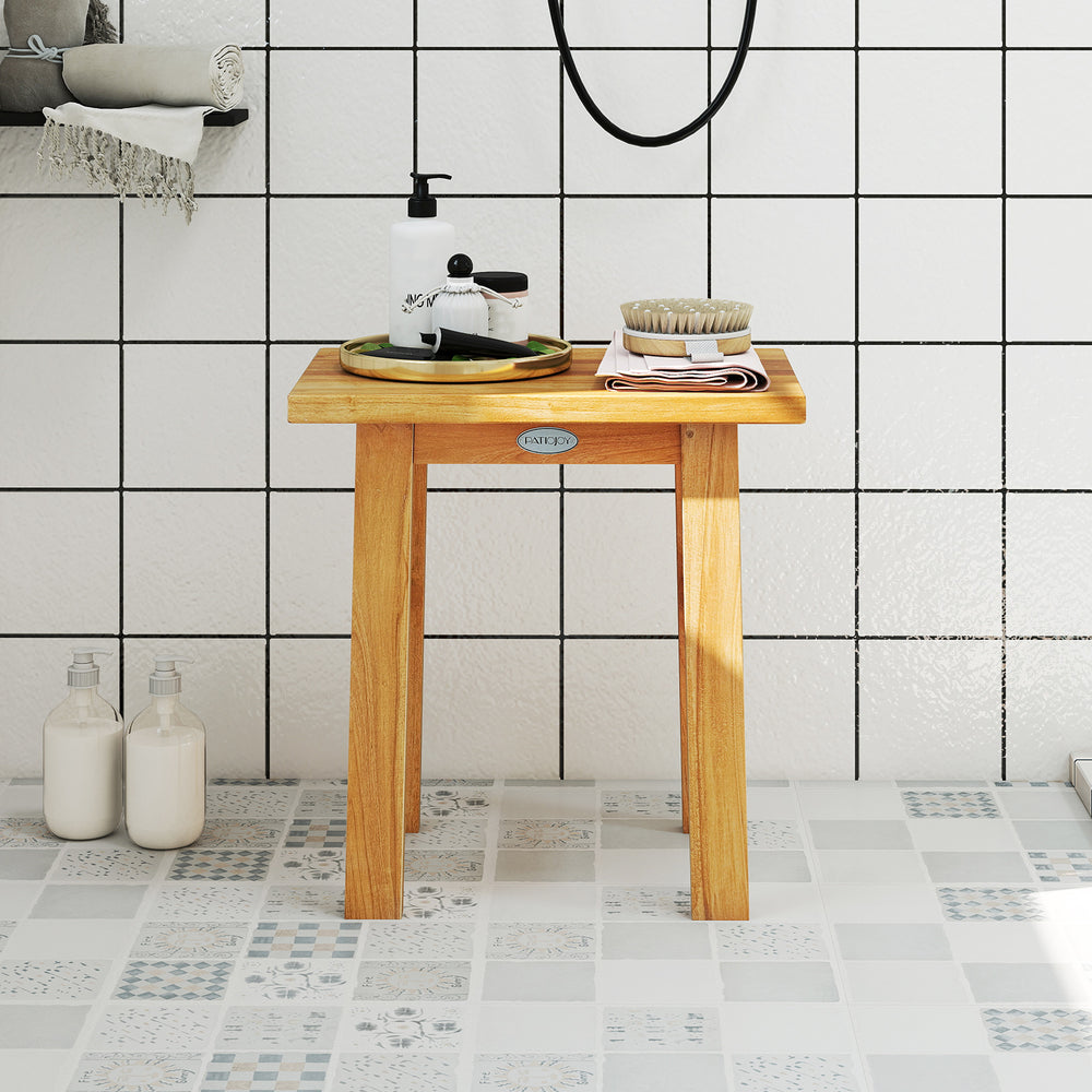 Teak shower bench with solid construction and water-resistant finish, perfect for shaving legs or as a side table.