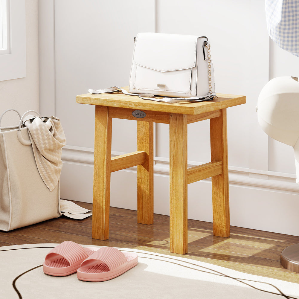 Teak shower bench with solid construction, water-resistant finish, ideal for shaving legs or as a side table.