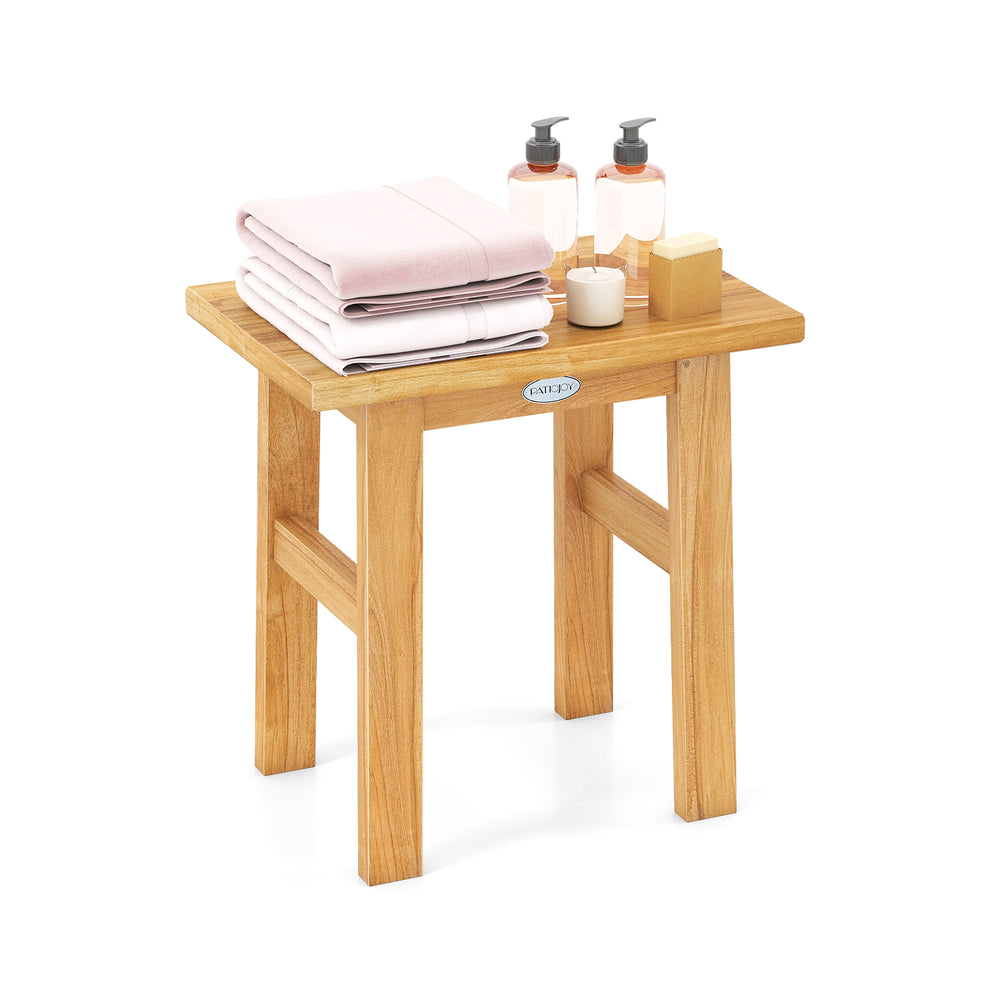 Teak shower bench with solid construction, water resistance, and compact design, perfect for shaving legs or as a side.