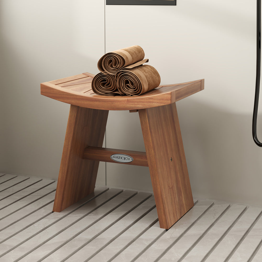 Teak wood shower bench with curved seat, featuring sturdy construction and drainage gap, ideal for bathroom use.