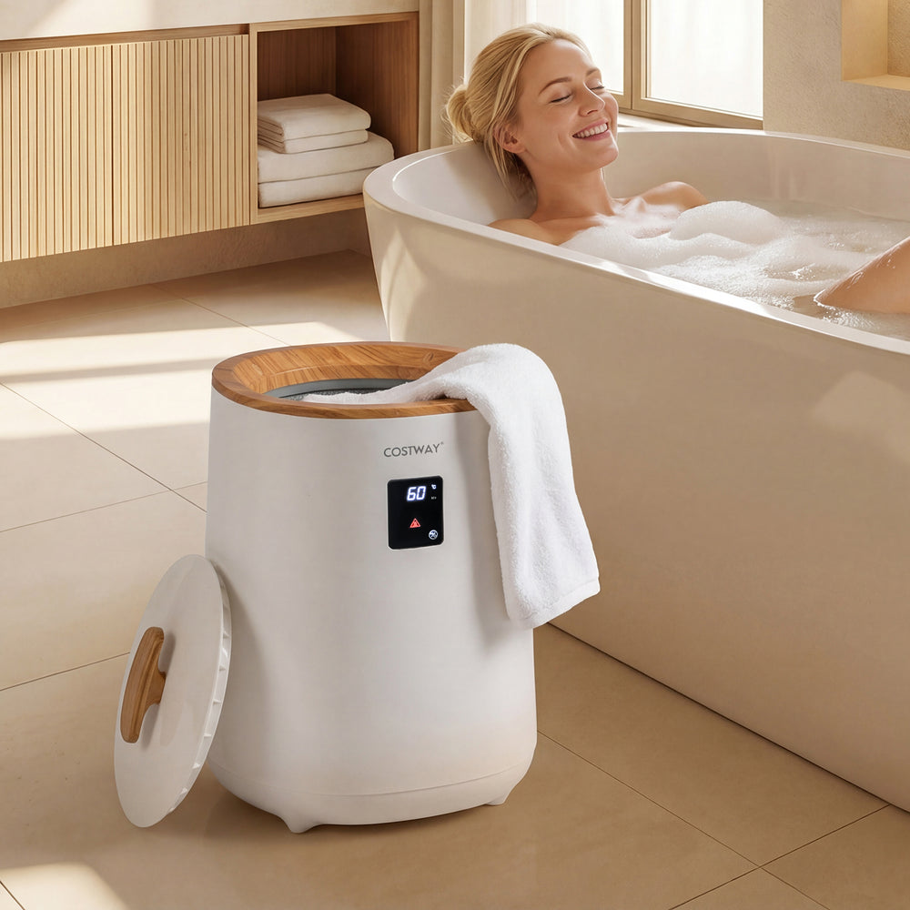 Large white towel warmer with LED display, 18 L capacity, placed beside a bathtub for a spa-like experience.