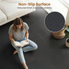 Interlocking black EVA foam floor tiles with a non-slip surface, ideal for home gyms and living spaces.