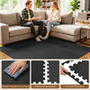 Interlocking black EVA foam floor tiles with borders provide comfort and protection for living rooms and home gyms.