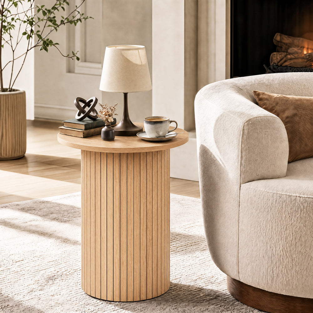 Round fluted side table in natural finish, featuring a sturdy pedestal design and non-slip foot pads for small spaces.