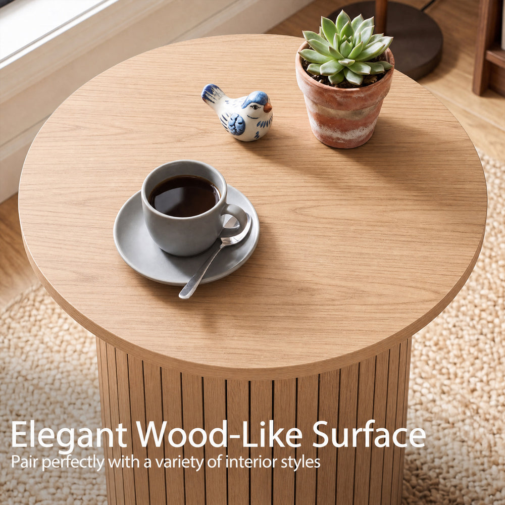 Round fluted side table with an elegant wood-like surface, perfect for small spaces in various interior styles.