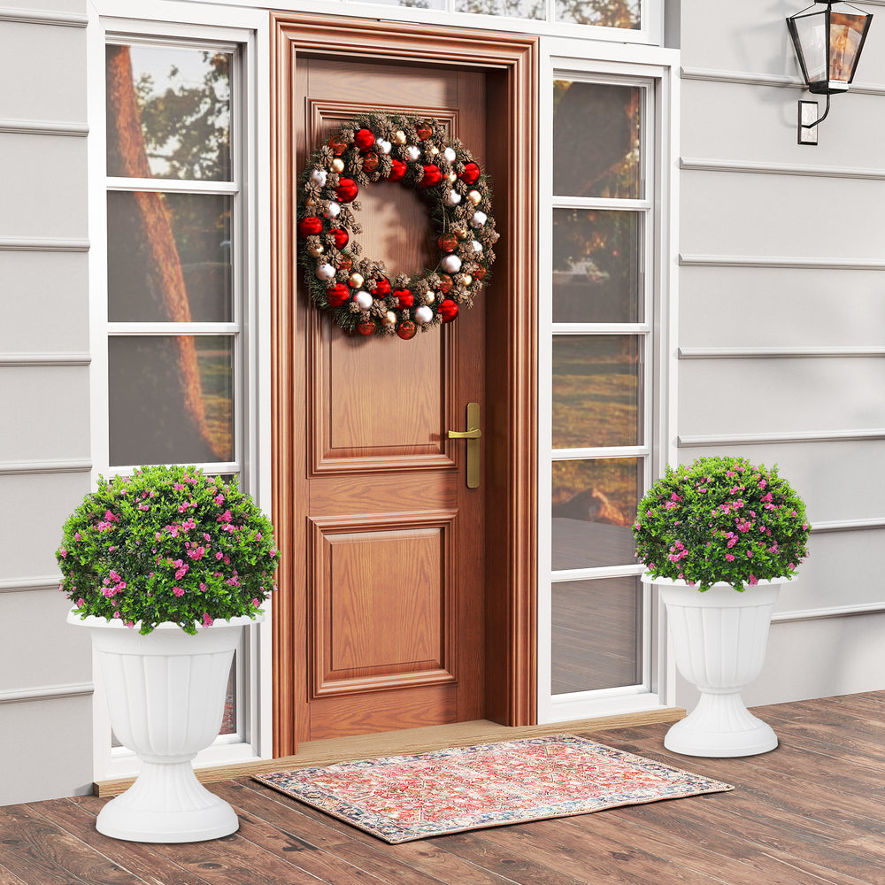 Vintage 18-inch tall white planters with pedestal base, perfect for indoor and outdoor settings like front porches.