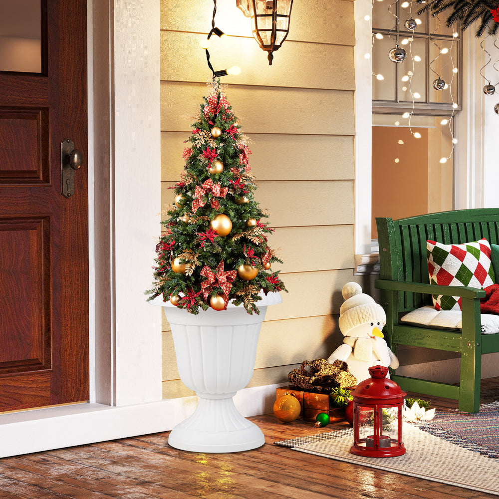 Vintage white planter with pedestal base, perfect for indoor or outdoor use, showcasing a festive tree and decorations.